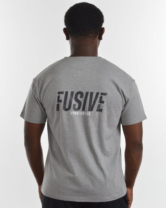 Person wearing a gray t-shirt with 'FUSIVE' branding on the back against a white background