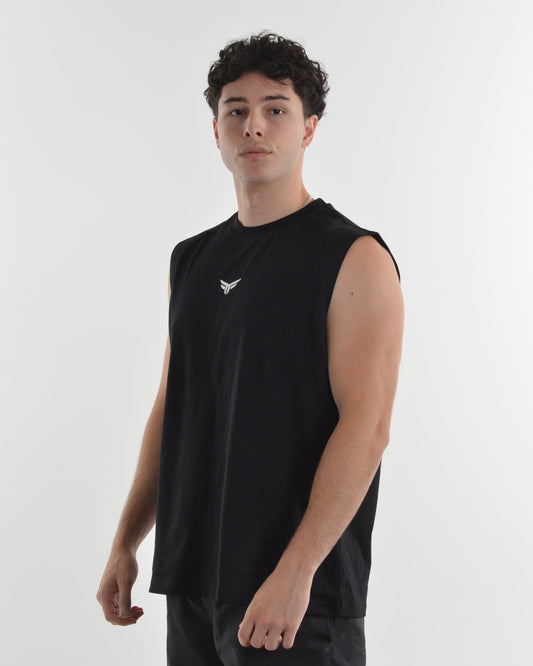 Person wearing a black sleeveless shirt on a white background