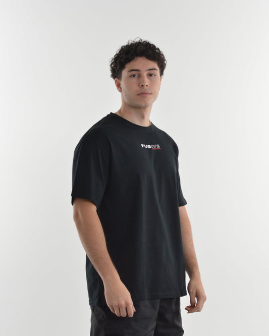 Person wearing a black t-shirt with a logo on a white background