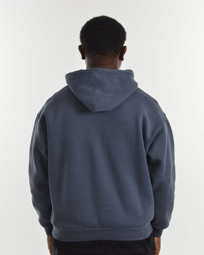 Person wearing a blue hoodie from behind on a white background