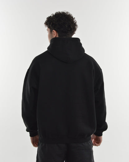 Person wearing a black hoodie from behind on a white background
